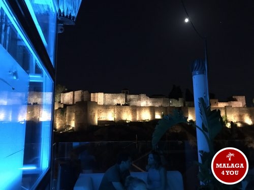 batik rooftop bar by night alcazaba